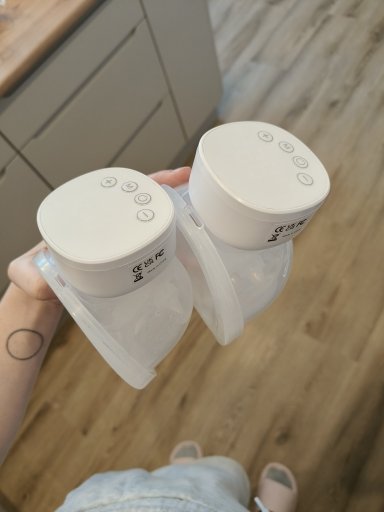 Customer photo: two wearable pumps held in one hand