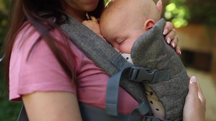 Close-up of a sleeping baby in the carrier