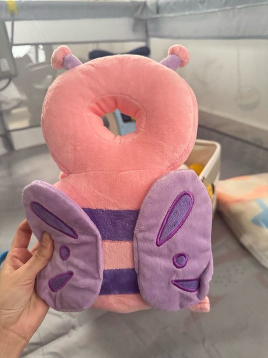Customer photo: the butterfly design pillow held in a hand