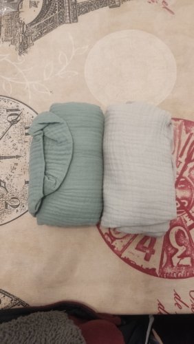 Customer photo: two muslin covers rolled up side by side