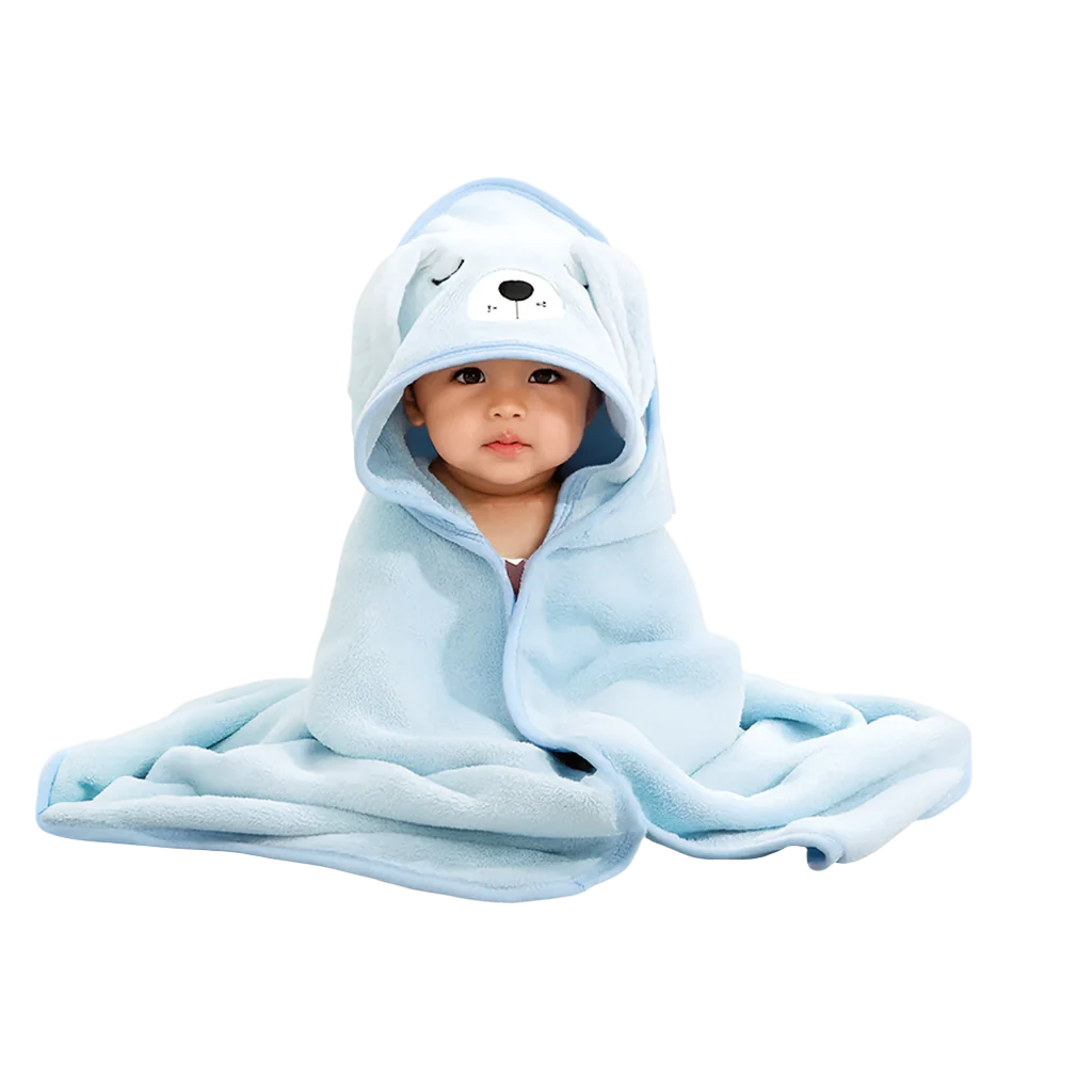 Baby wrapped in a light blue hooded towel with bear ears, looking at the camera