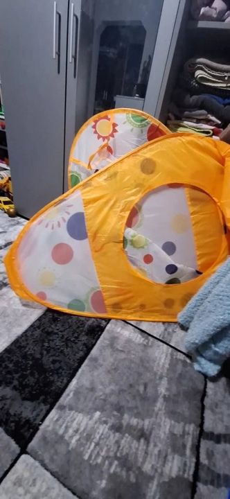 Customer photo: the pop-up play tent set up next to a wardrobe
