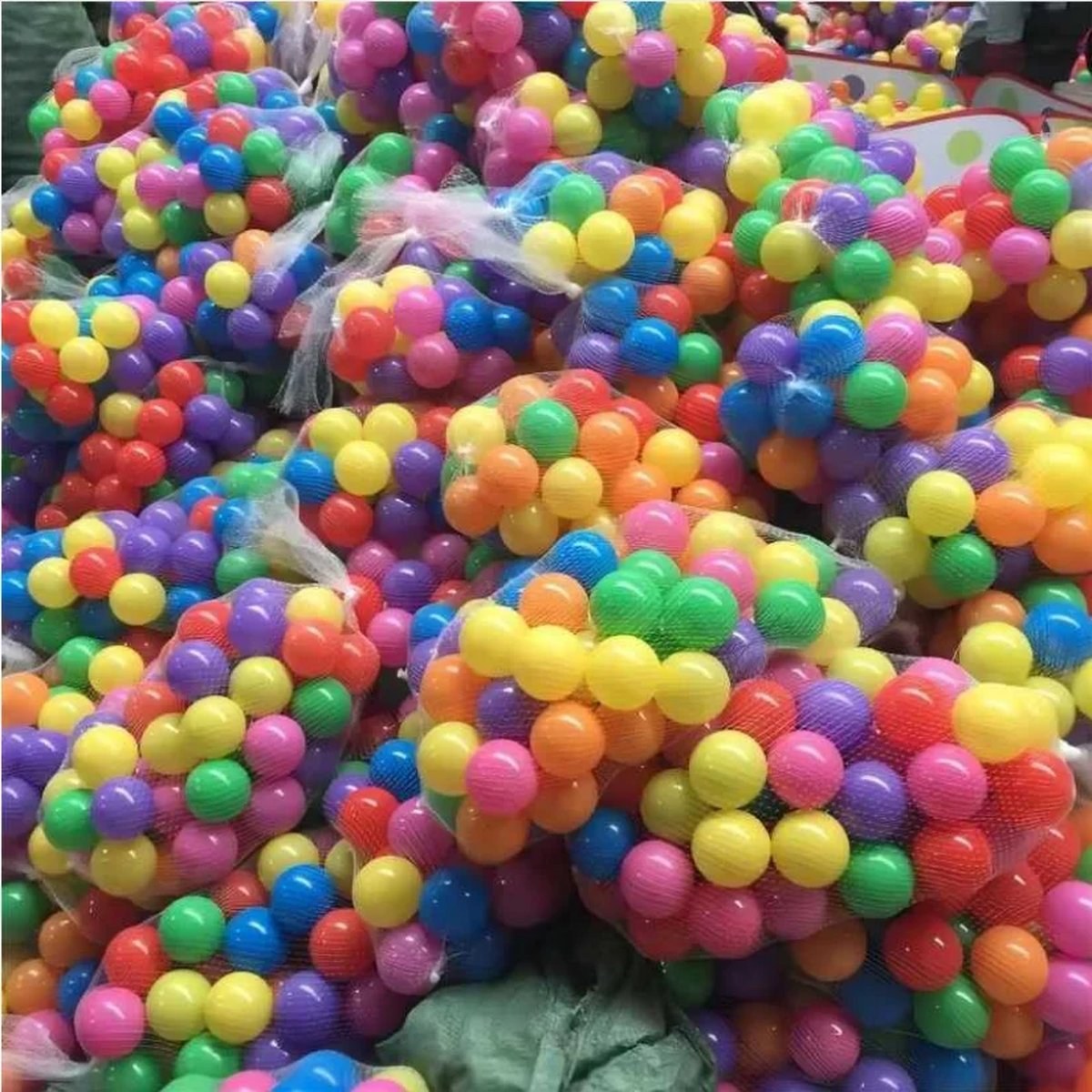 Close-up of mixed-color balls in their mesh bags