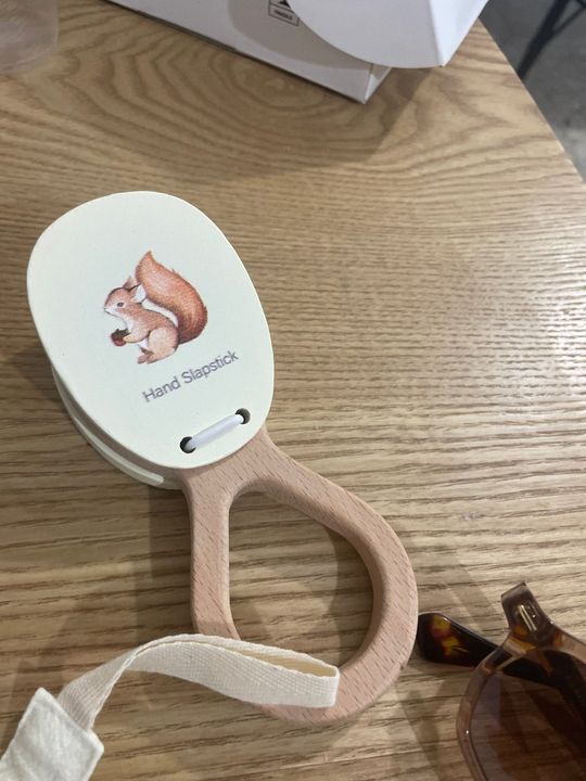 Customer photo: the Hand Slapstick wooden instrument on a table